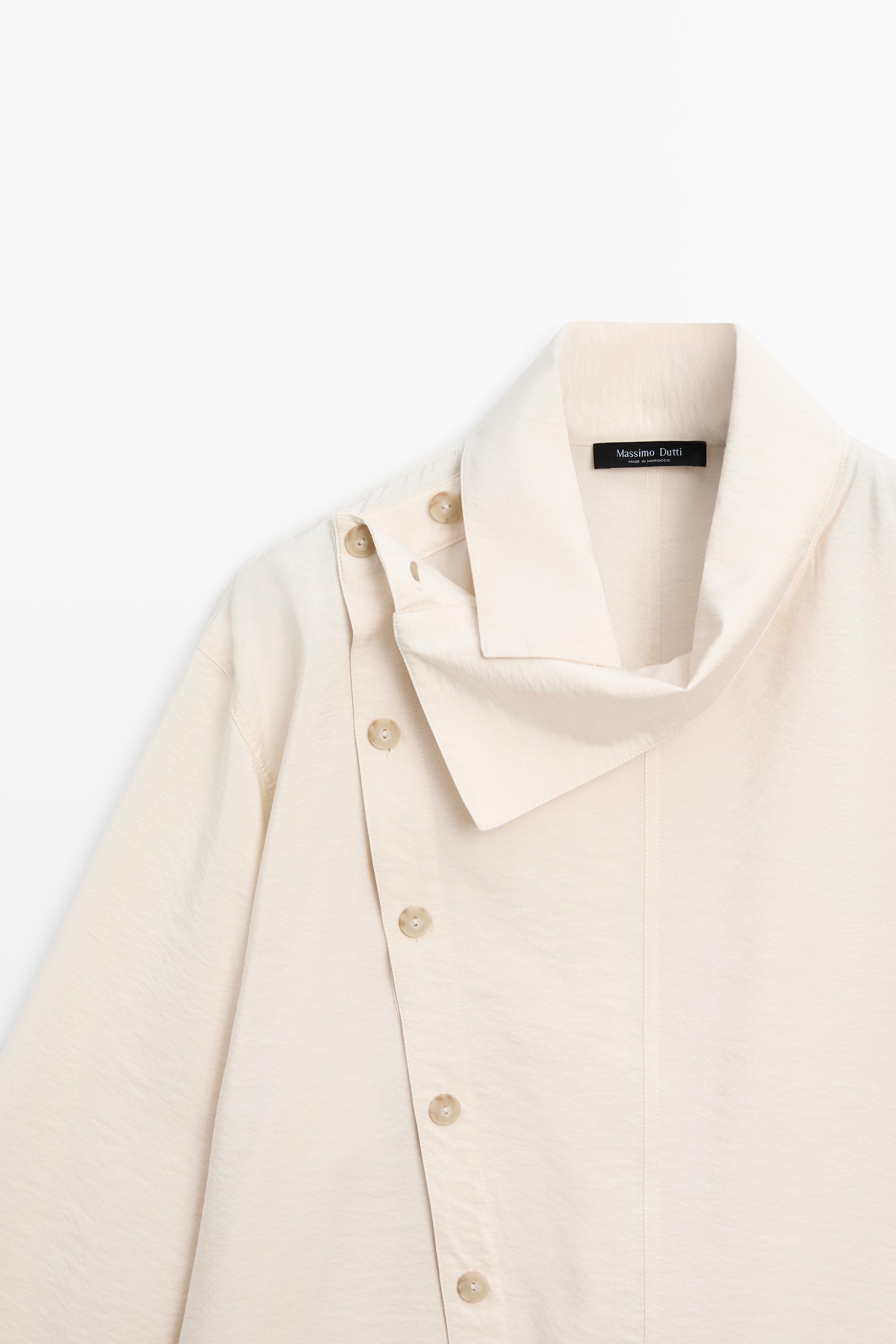 Flowing shirt with asymmetric buttons